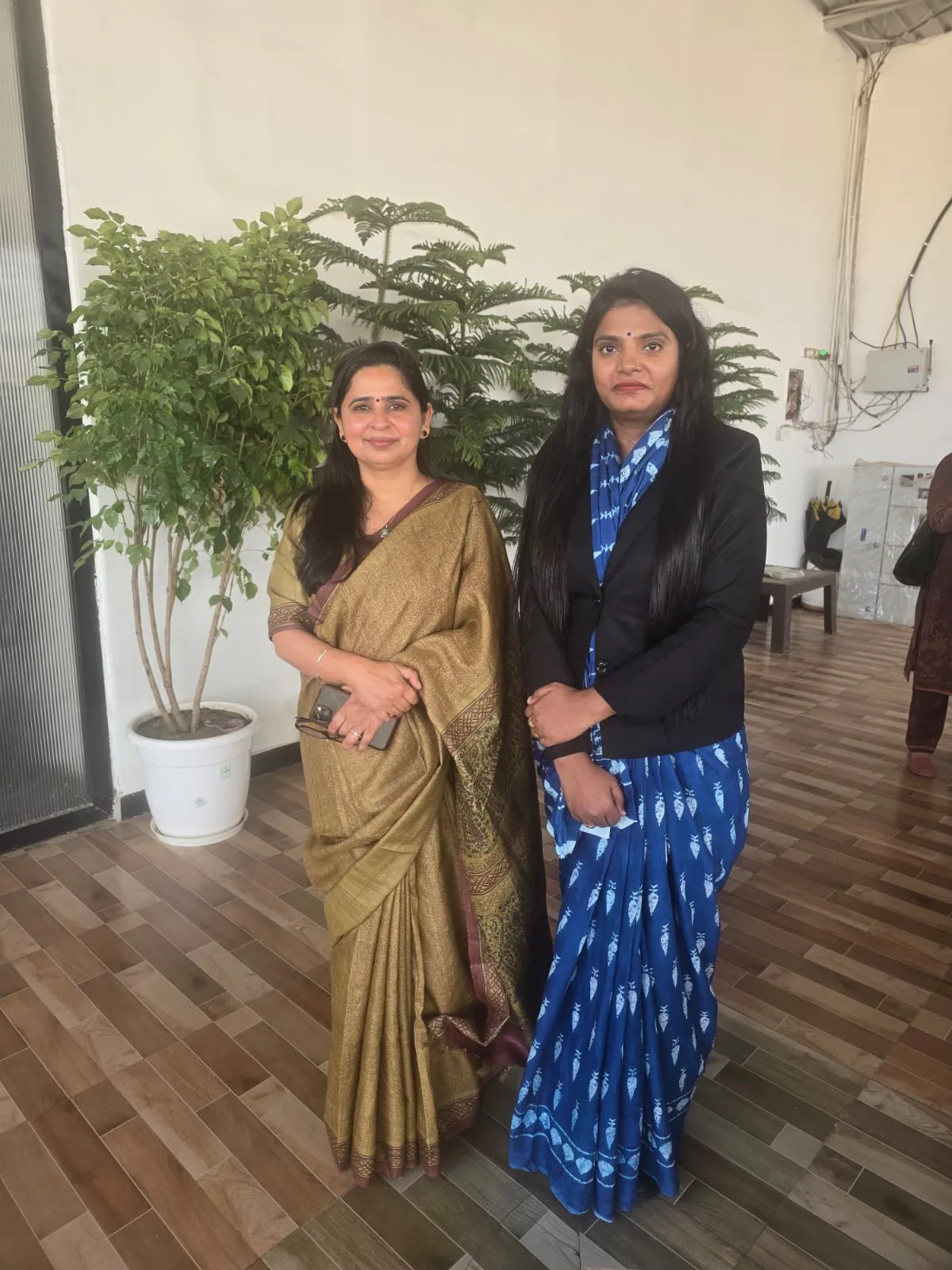Dr. Nidhi Kant with another attendee at a professional community setting