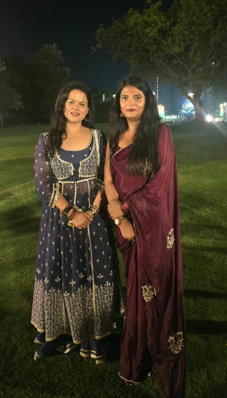 Dr. Nidhi Kant with a guest during an evening community gathering